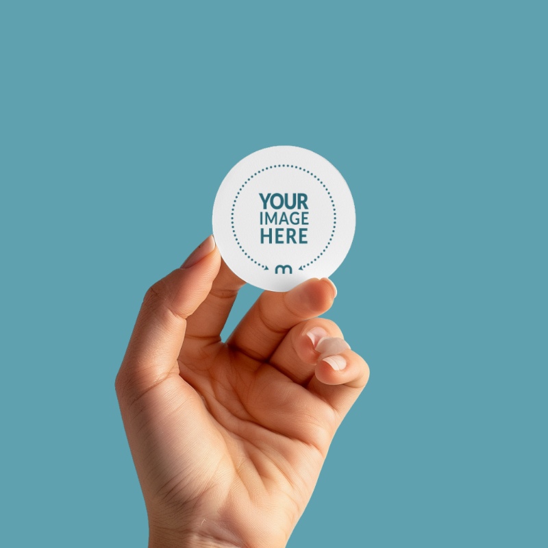 round-sticker-mockup-held-by-a-person building-signage-tauranga-bay-of-plenty